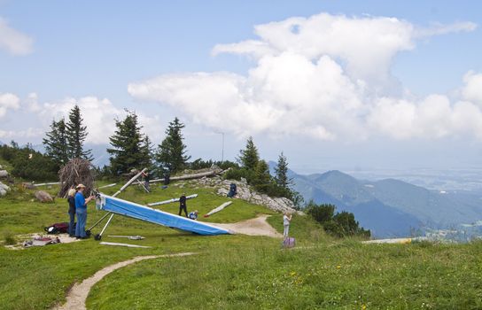 Rupholding, Germany - August 05:  Some people preparing their hangglider for a flight in the German Alps on  August 05, 2009.