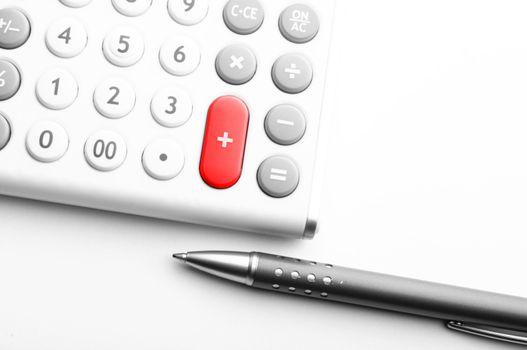 accounting concept with calculator and pen in business office