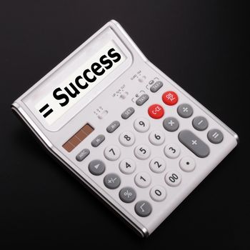 success concept with word on business calculator