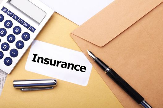 insurance concept with envelope showing risk concept