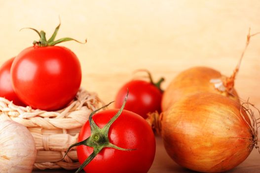 tomatoes and garlic in kitchen showing healthy food concept