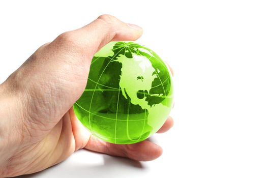 ecology concept with hand and glass globe isolated on white background