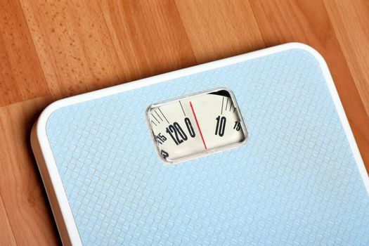 Closeup view of scales on a floor. Dieting concept.