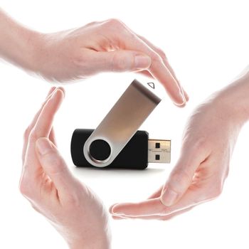 usb stick or flash drive with hands isolated on white background