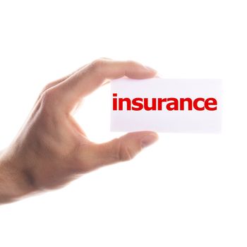 insurance concept with hand word an paper