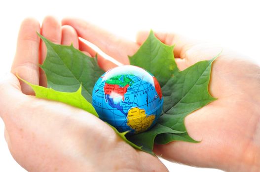 globe and leaf in hands for environmental conservation