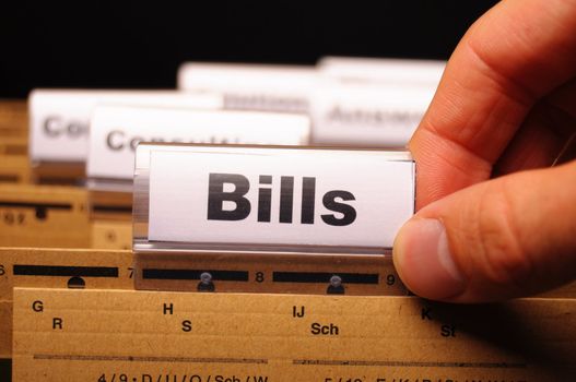 bill or bills word on paper riders showing payment or debts concept