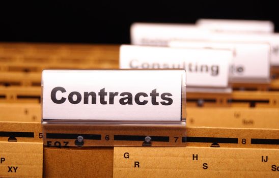 contract word on business folder showing trade or financial concept