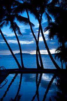 Pool and palmes shot right after a sunset in Hawaii