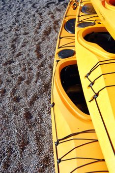 Recrational kayaks on shore