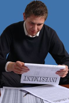 business investor reading a  investment plan