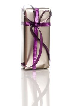 Silver Gift with violet straps on white with relflection