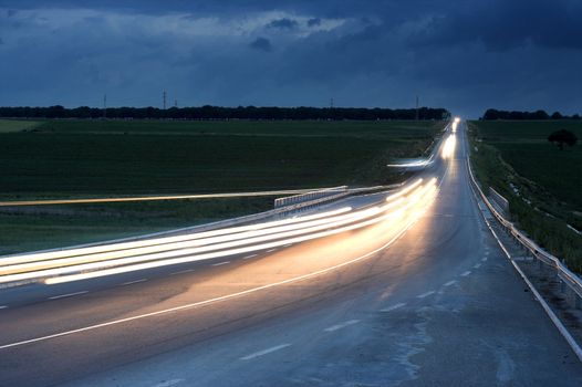 lihgttracks over the highway by night