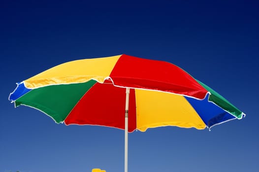  beach umbrella and deep blue sky