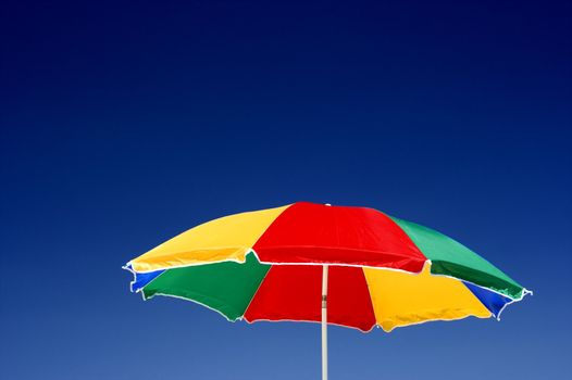  beach umbrella and deep blue sky