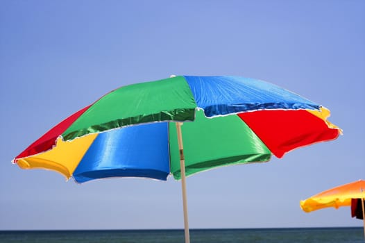  beach umbrella and deep blue sky