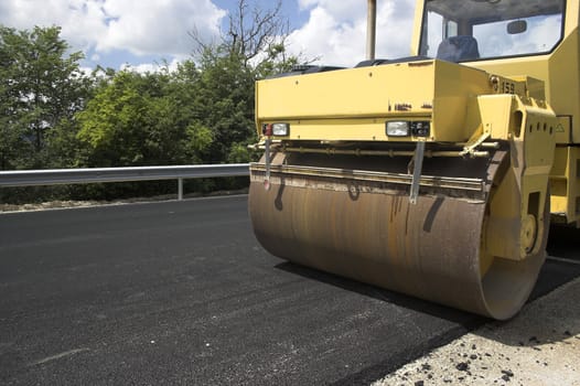 Road roller in work on the road