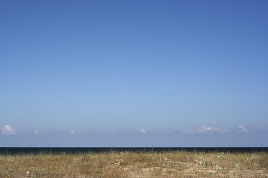 Blue sky minimalistic view of a beach