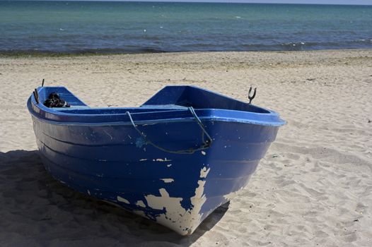  fishing boat standing on the sand of a beach