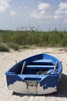  fishing boat standing on the sand of a beach