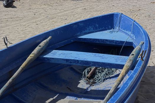  fishing boat standing on the sand of a beach