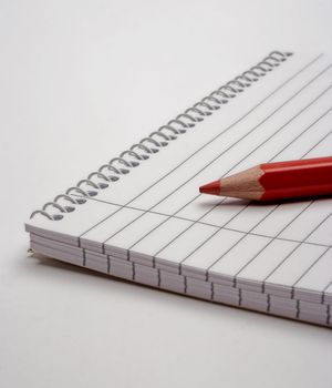 Blank notebook and doublecolored pencil,isolated