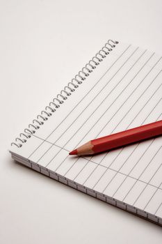 Blank notebook and doublecolored pencil,isolated