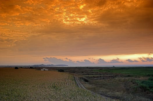 Landscape with cloudy red sky