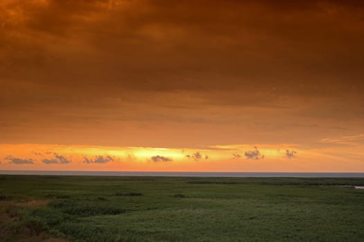 Landscape with cloudy red sky