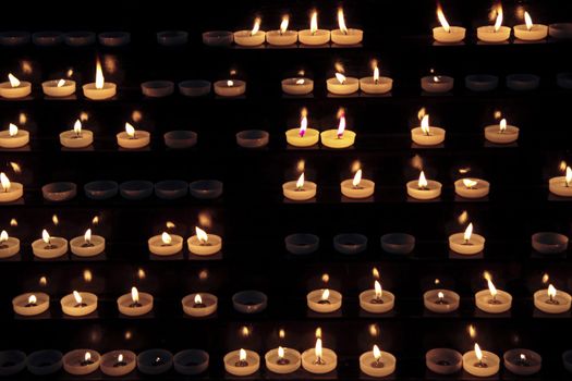 candles alight within a church