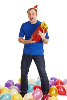 The cheerful man with a New Year's gift in hands isolated on a white background