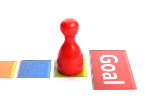business goal concept with word and game pawn
