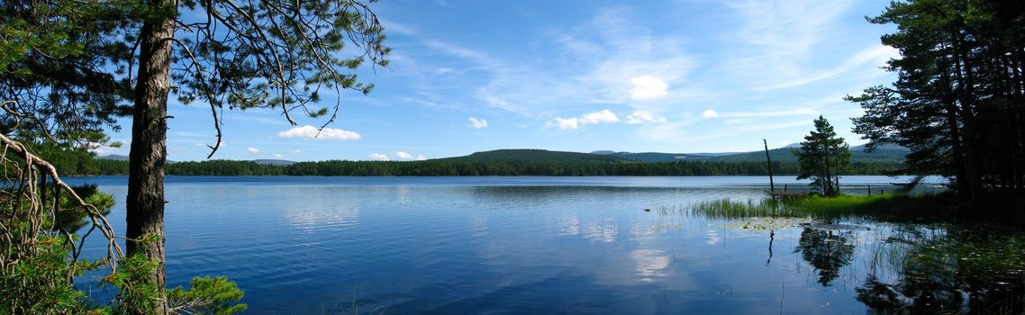 Panorama of three photos stitched of beautiful lake