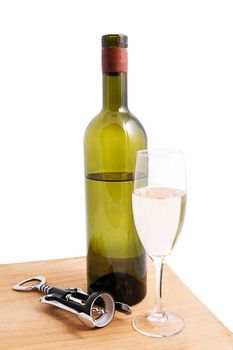 White wine bottle and glass with corkscrew over white