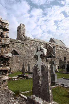 ancient celtic crosses in the graveyard of an old irish church