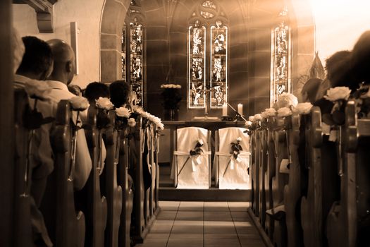 Seats on the altar of a wooden wedding church