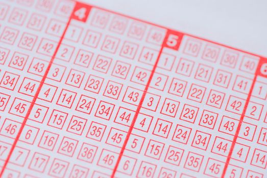 A paper lottery ticket with selective focus