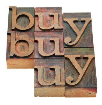 buy word abstract in vintage wooden letterpress printing blocks, stained by color inks, isolated on white