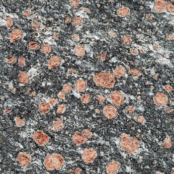 Seamless texture - dark stone surface with red minerals