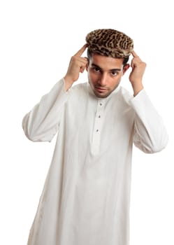 An ethnic man in white embroidered robe and a leopard fur topi hat.