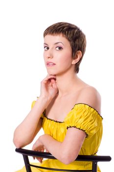 beautiful young woman wearing yellow dress isolated on white