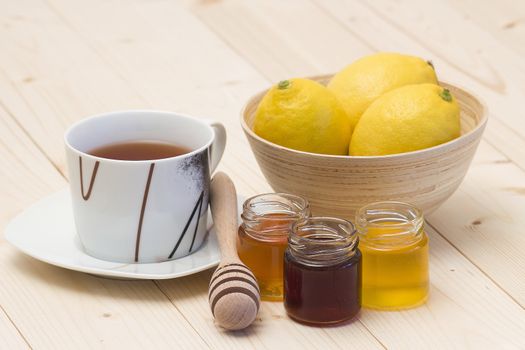 cup of tea, fresh lemons and honey
