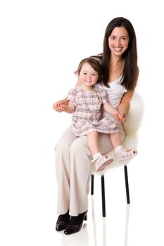 Mother with daughter sitting on chair isolated on white