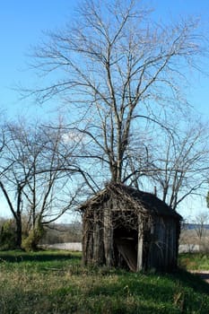 A Old wooden shed with blue sky