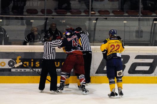 ZELL AM SEE, AUSTRIA - DECEMBER 7: Austrian National League. Jari Suorsa and Seewald fighting. Game EK Zell am See vs. Red Bulls Salzburg (Result 4-6) on December 7, 2010, at hockey rink of Zell am See