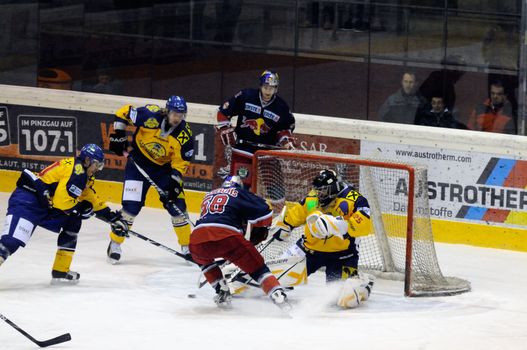 ZELL AM SEE, AUSTRIA - DECEMBER 7: Austrian National League. Big save by Goalie Bartholomaeus. Game EK Zell am See vs. Red Bulls Salzburg (Result 4-6) on December 7, 2010, at hockey rink of Zell am See