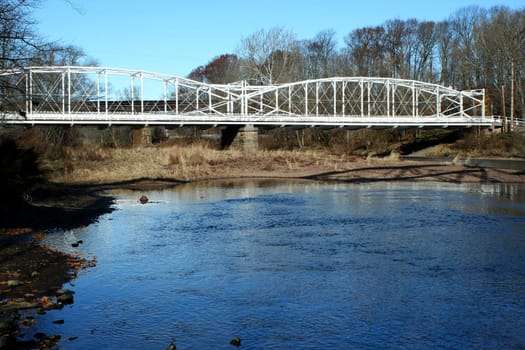 a White bridge over a river