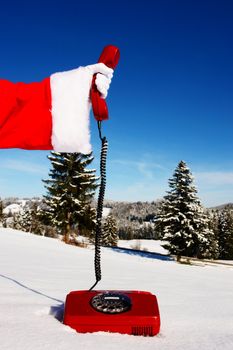 Santa Claus Hotline symbolized by a red retro phone