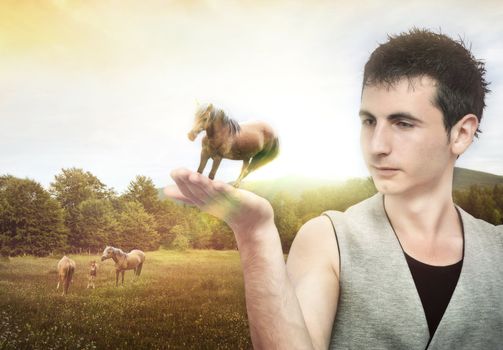 Young man holding a horse