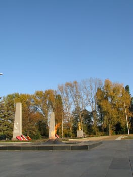 Monument; eternal flame; laid; architectral building; styles; park